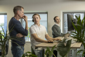 a group of men in an office