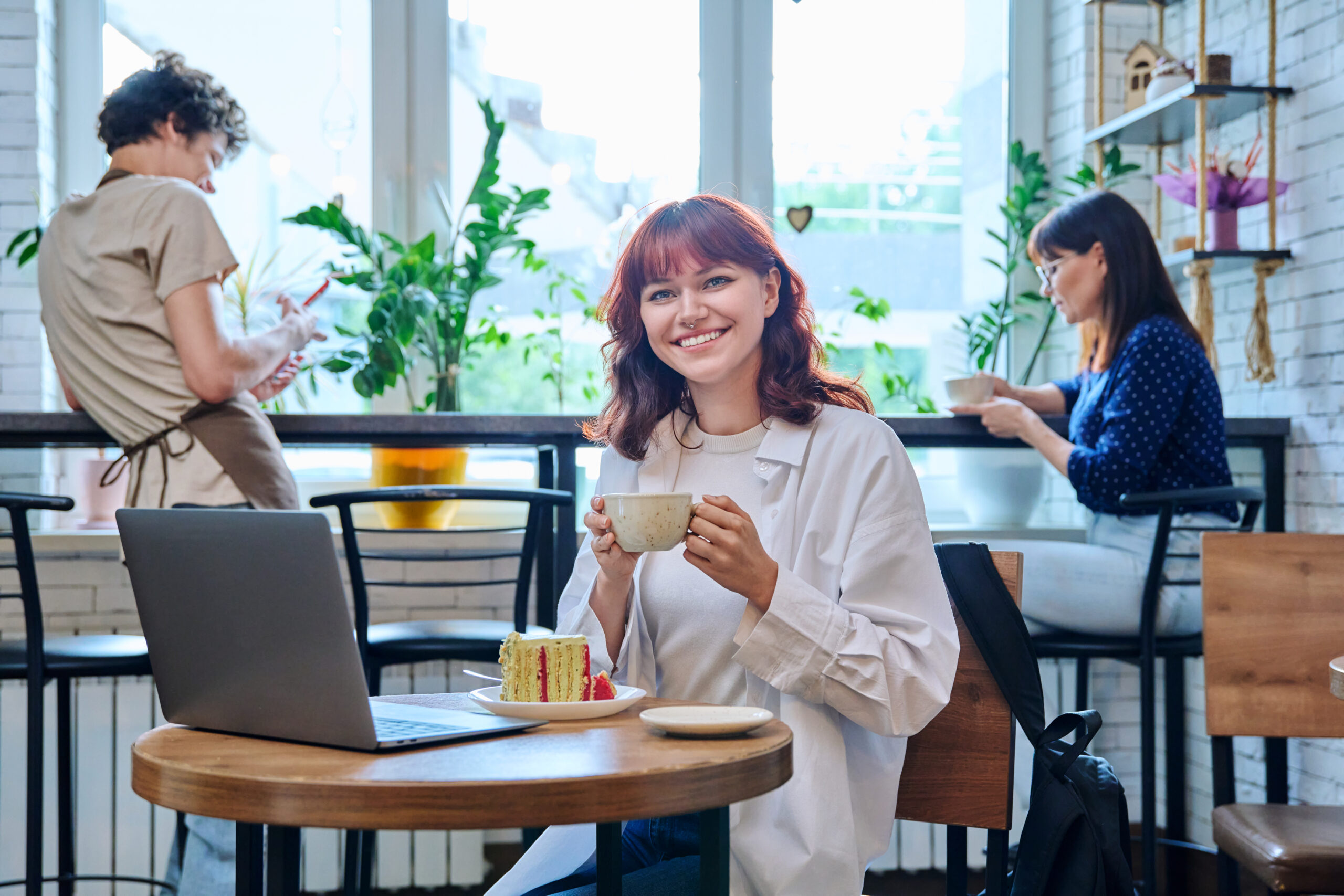 female college student with laptop in cafe with c 2024 12 08 02 59 17 utc