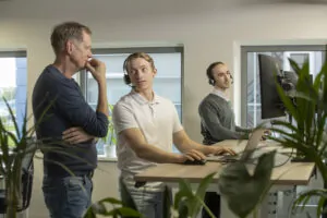 a group of men in an office