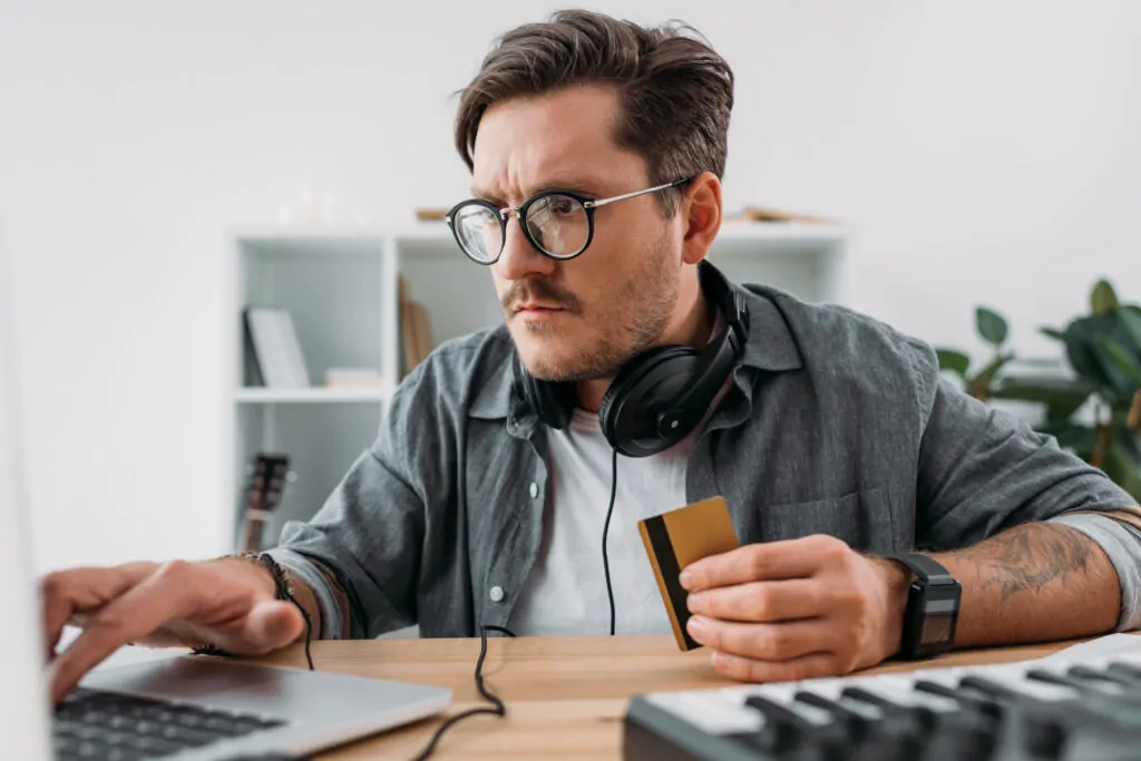 serious young man making e shopping with laptop an 2024 11 19 19 48 00 utc