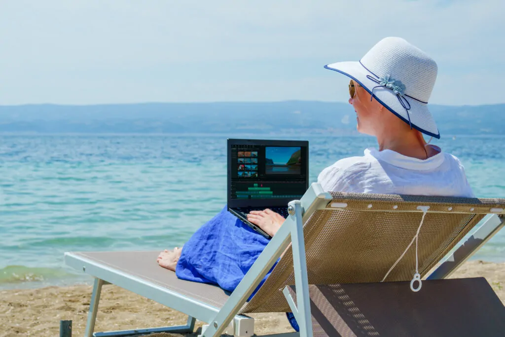 video blogger freelancer editing video at beach 2025 01 08 23 33 03 utc